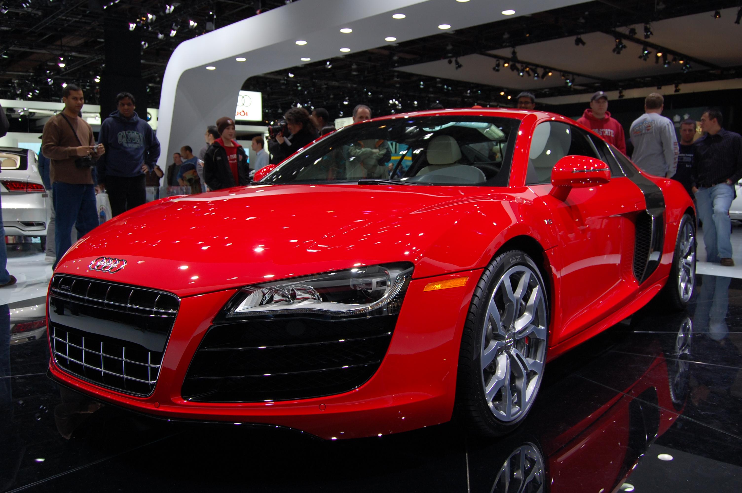Red first-generation Audi R8 V10 coupe at the 2009 North American International Auto Show; its gearbox is not visible.