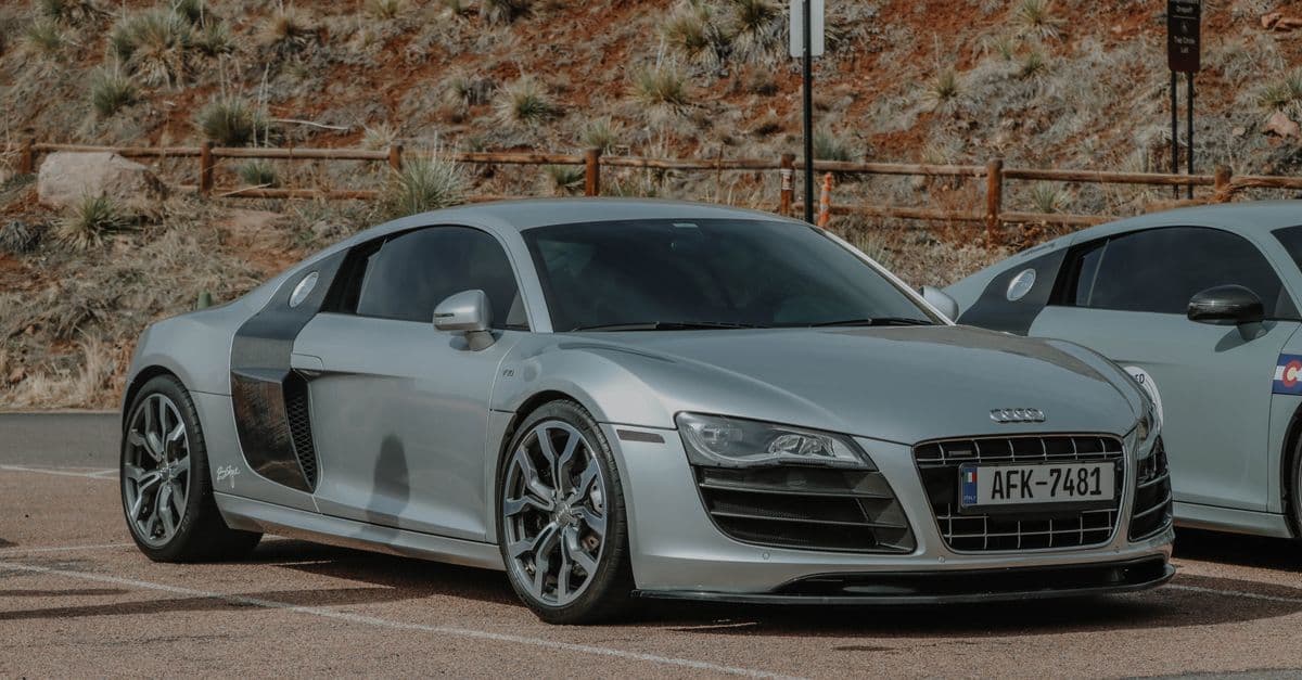 Photo: Jacob Moore / Pexels Silver first-generation Audi R8 V10 parked beside another R8.
